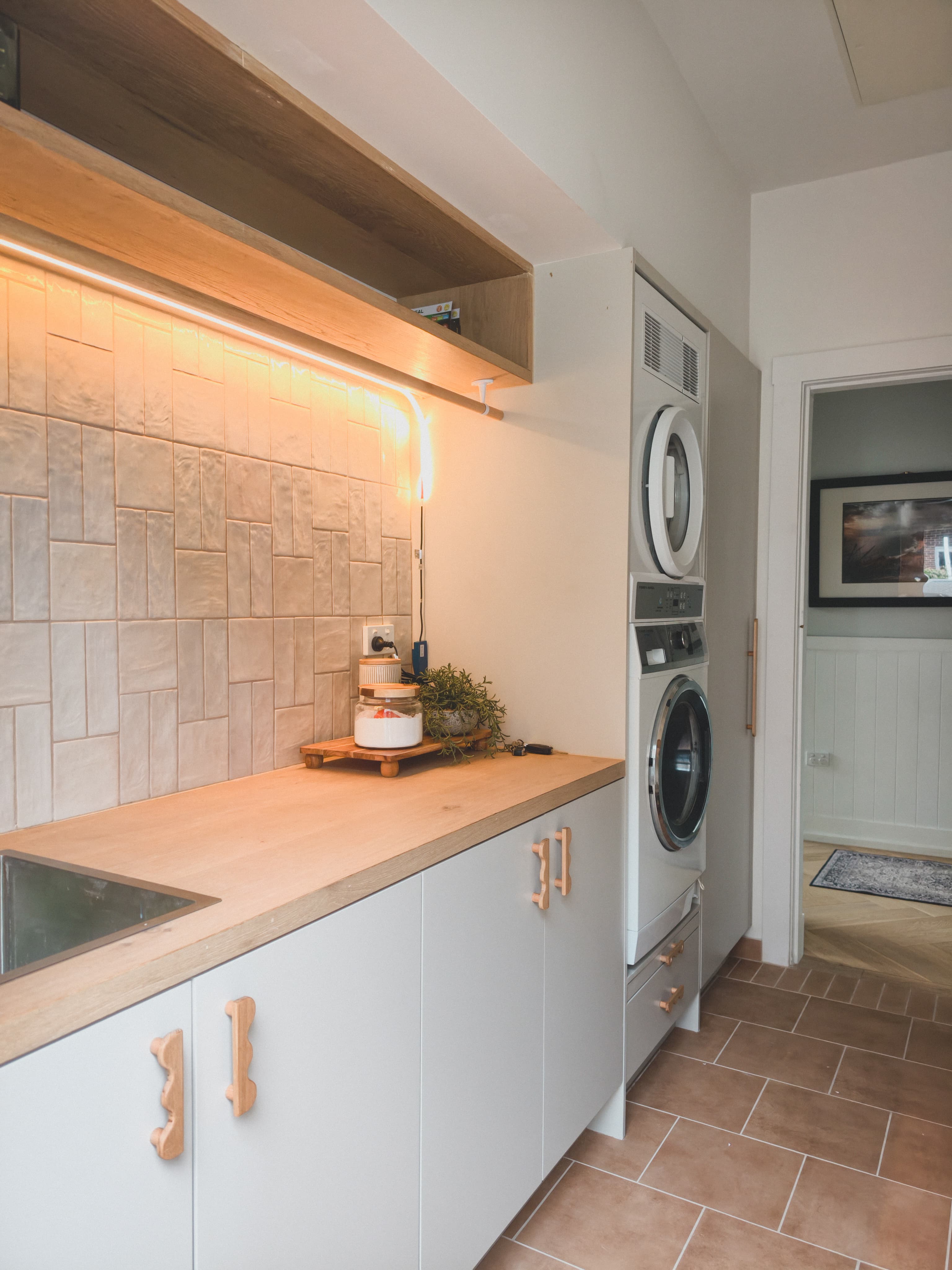 Completed laundry renovation by VIKING Design + Build, Wollongong